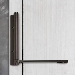 Bras à ressort ferme porte, a corps très fin en Aluminium anodisé noir-Hardwarexchange